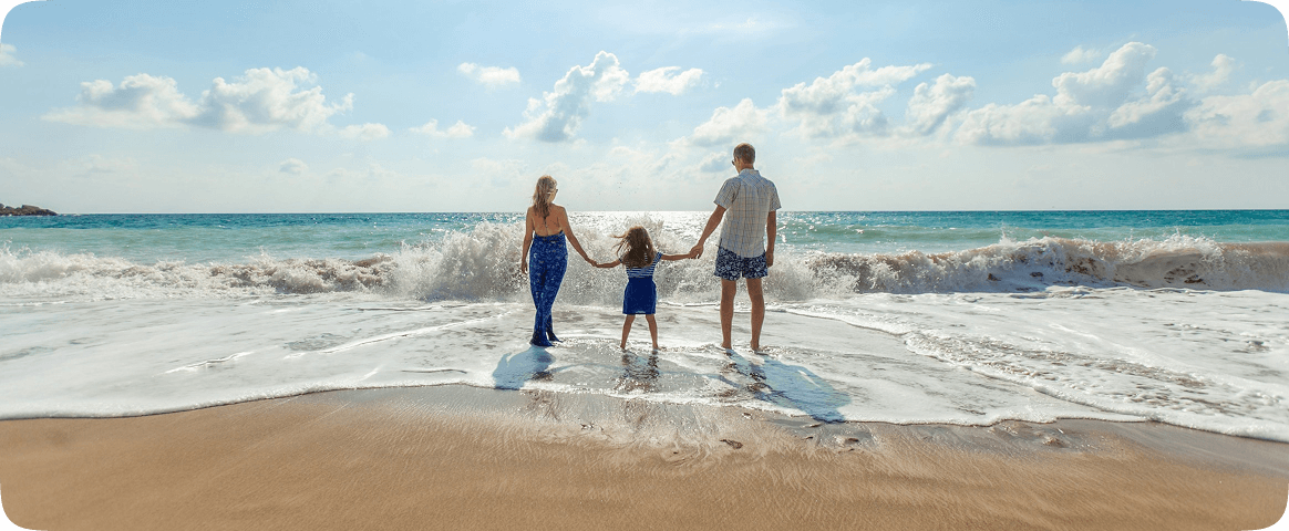 Family traveling on beach
